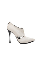 White high-heeled shoe on a white background