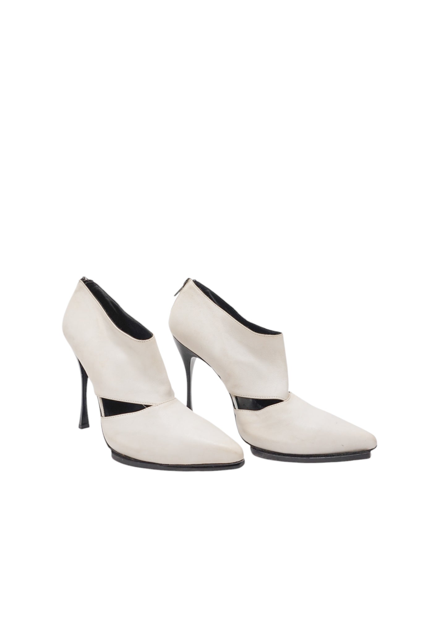Pair of white high-heeled shoes on a white background