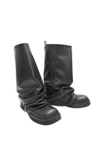 Pair of black knee-high boots on a white background