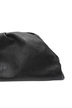 Black textured clutch bag on a white background