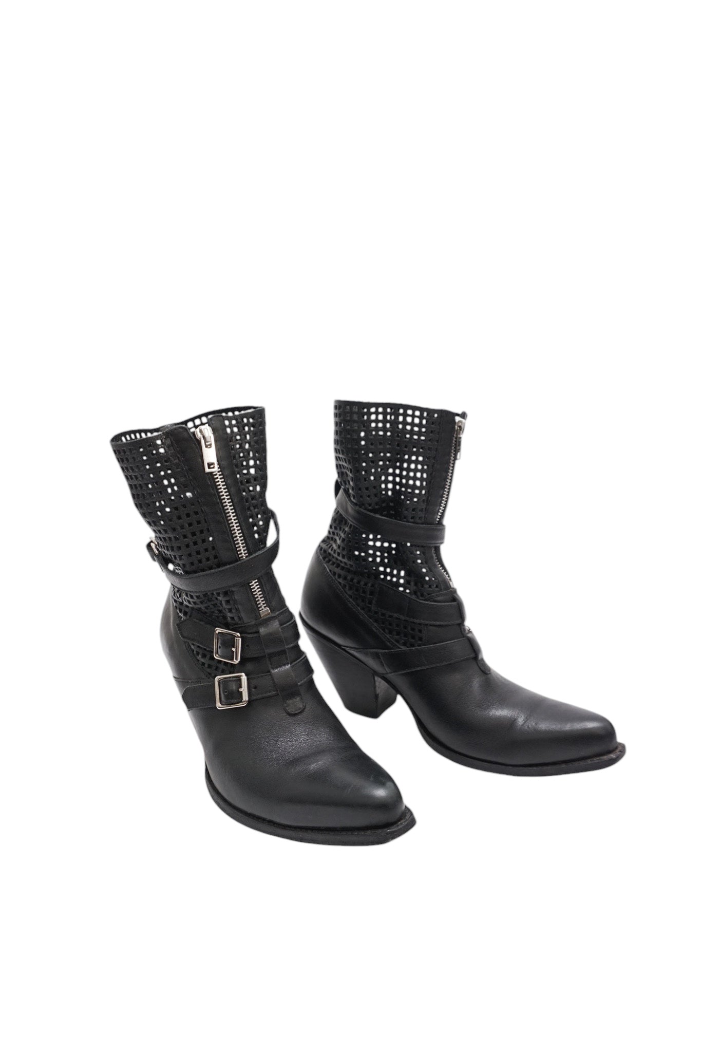 Black leather boots with perforated design and buckles on a white background