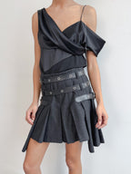 Black dress with unique design on a plain background