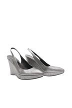 Pair of silver wedge sandals on a white background