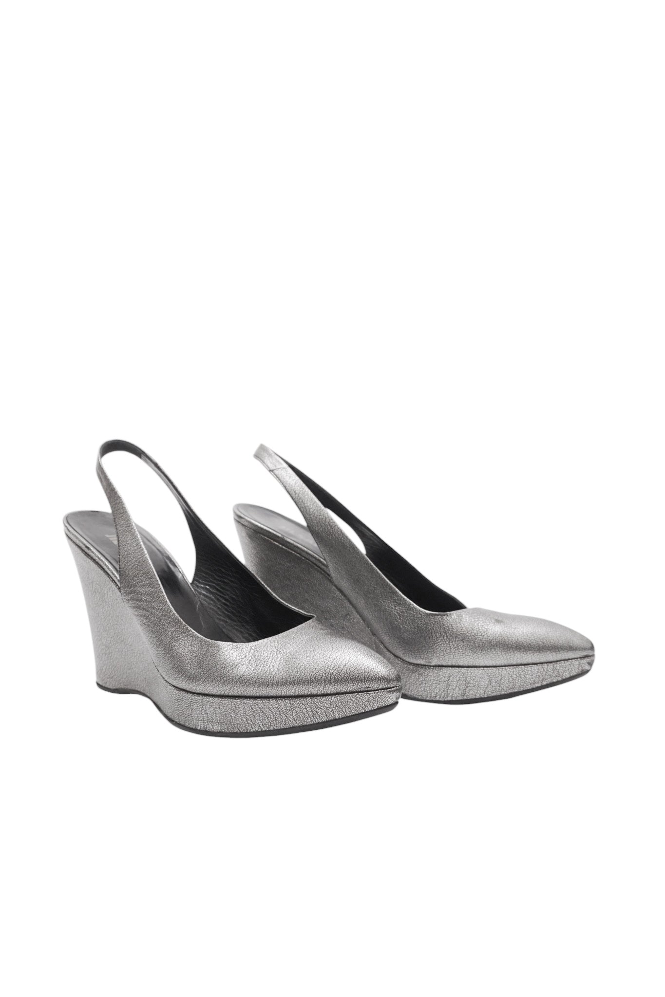 Pair of silver wedge sandals on a white background
