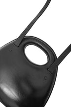 Black helmet with a circular visor on a white background