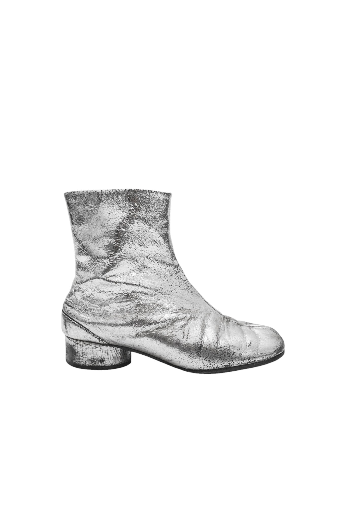 Black rain boot on a light gray background