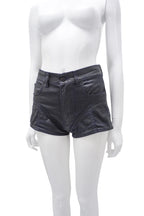 Black leather shorts on a white mannequin against a white background