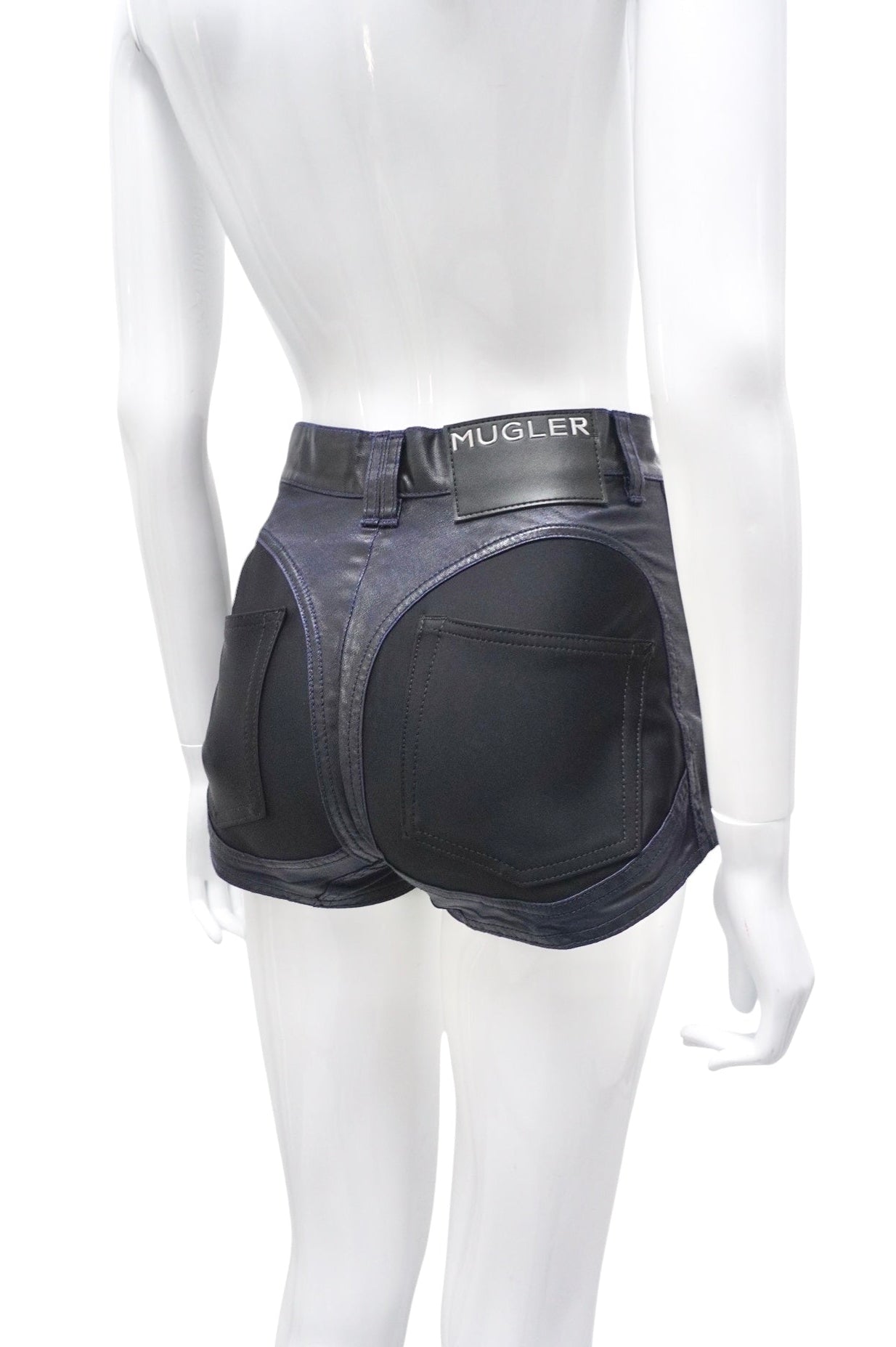 Black denim shorts on a mannequin with 'HUGLIER' branding.
