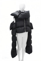 Mannequin wearing a black puffer jacket on a white background