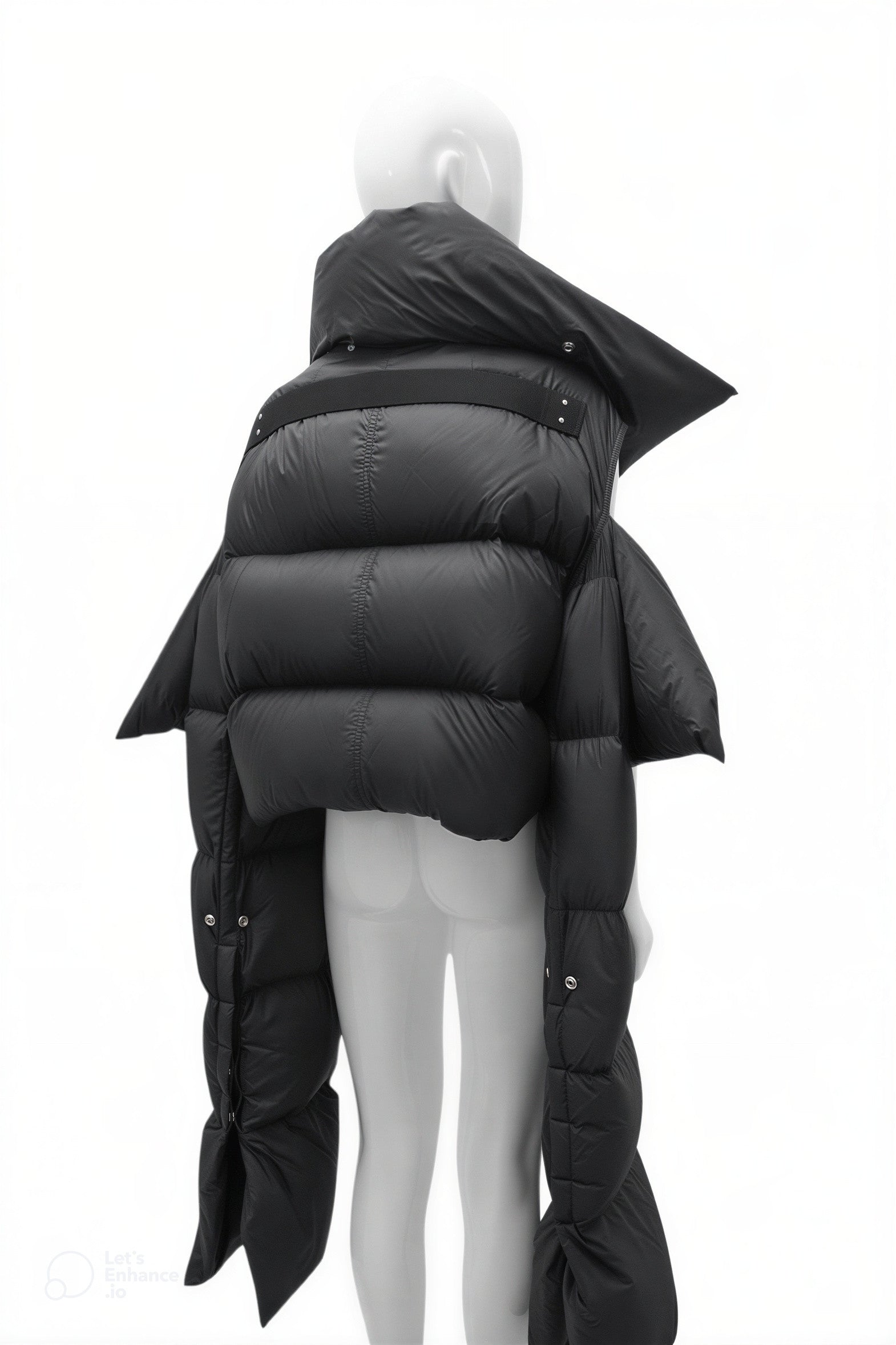 Black puffer jacket on a mannequin against a white background