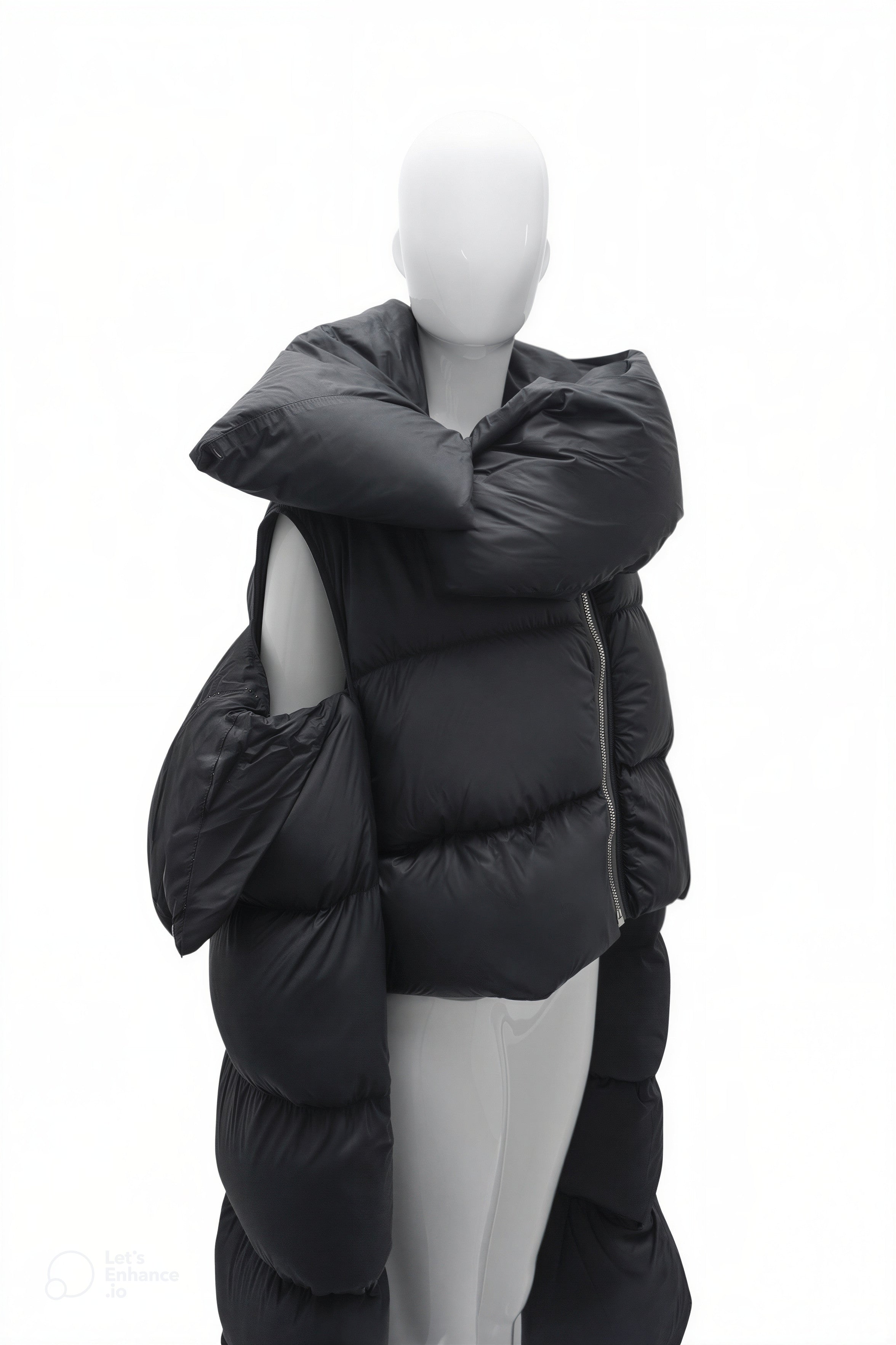 Black puffer coat on a mannequin against a white background