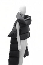 Mannequin wearing a long black puffer vest on a white background
