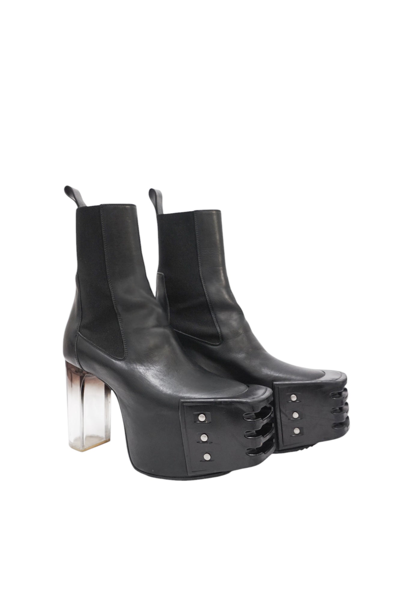 Black platform ankle boots with clear heel on a white background