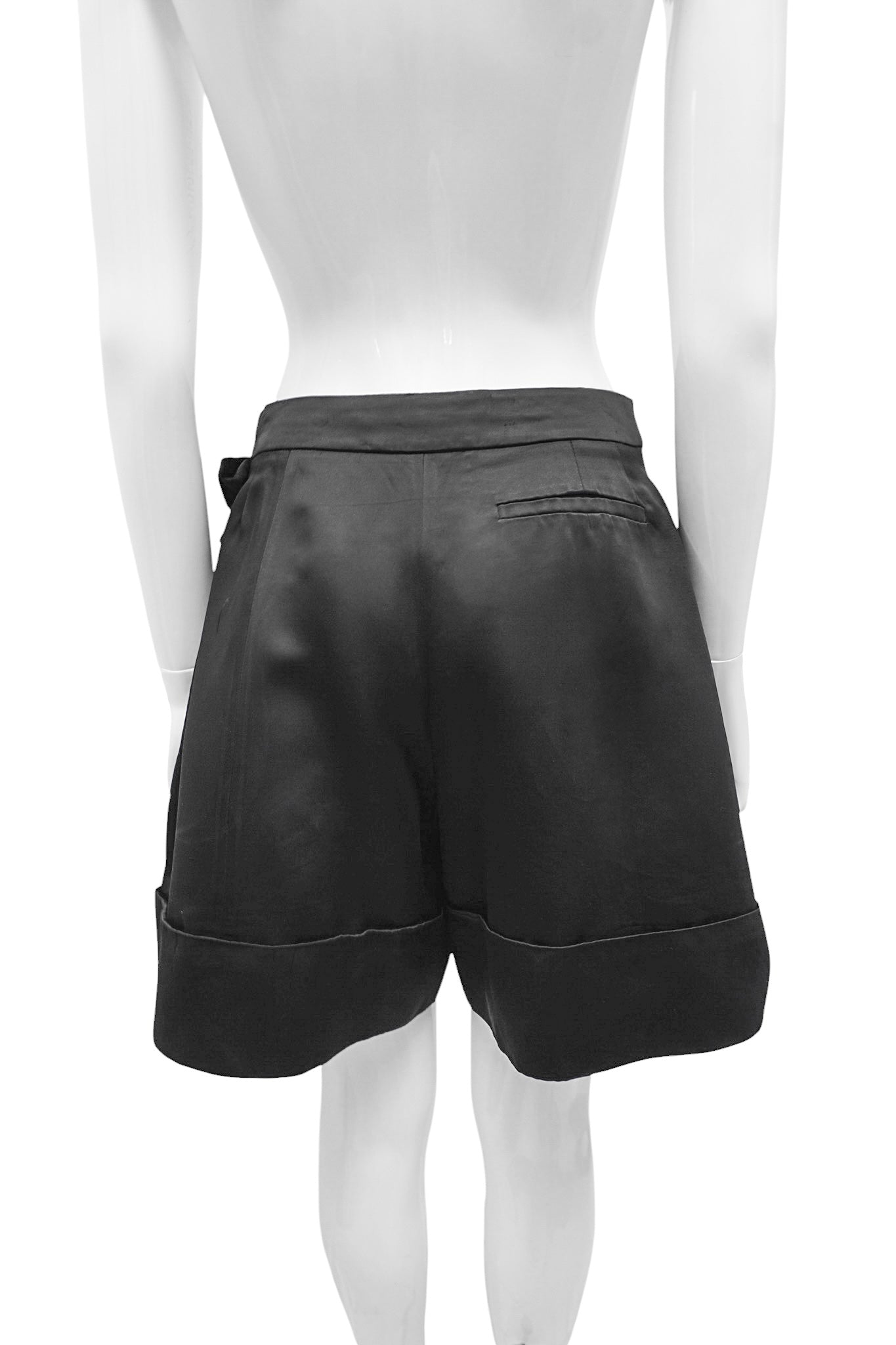 Black leather shorts on a white mannequin against a white background