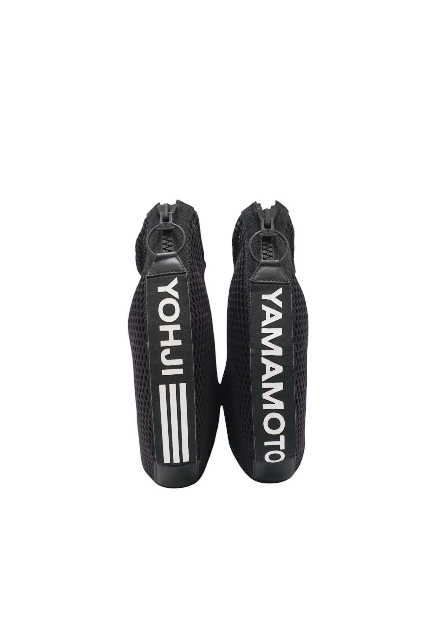 Two black zippered pouches with 'Yohji Yamamoto' branding on a white background